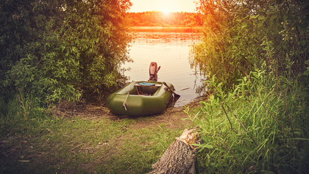 A fishing inflatable boat with a motor.の写真素材