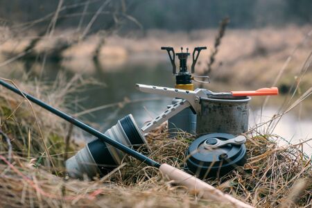 Cooking on a gas burner while camping.の写真素材