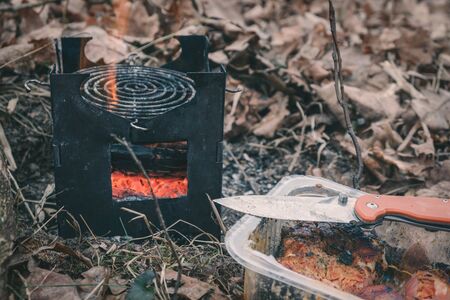 Cooking while hiking with a backpack.の写真素材