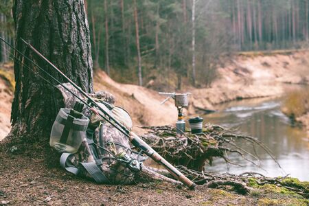 Fishing equipment on the river bank.の写真素材