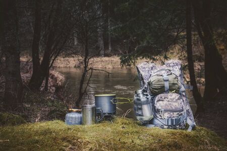 Cooking while hiking with a backpack.の写真素材