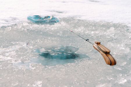 Winter fishing pole at the hole. Winter fishing.の写真素材