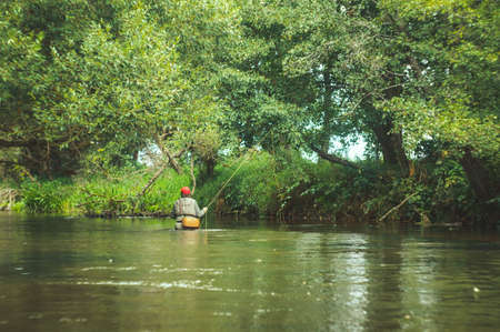 A fisherman fishing with fly fishing.のeditorial素材
