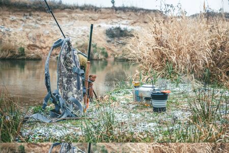 Lunch and cooking while hiking. Backpack, gas burner, kettle and other accessories for tourism and fishing.の写真素材