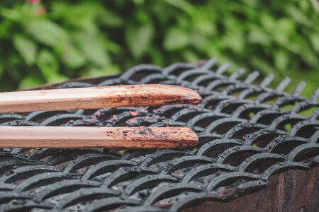 Wooden tongs for the grillの写真素材