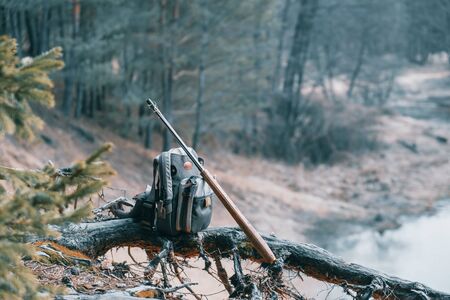 Fishing equipment close-up on the riverbank.の写真素材