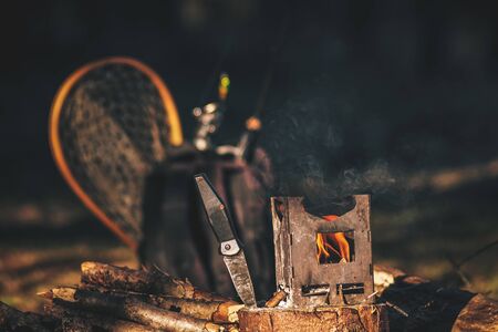 Firebox stove in the camp during fishing.