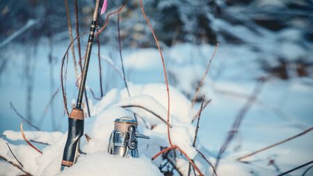Fishing with spinning in the winter. Freshwater fishing.の写真素材