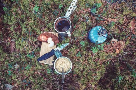 Snack cooked on a gas burner during a hiking trip.の写真素材