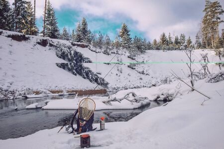 Firebox stove and grilled sausage. Picnic fishing.の写真素材