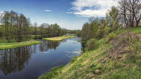 Spring river flowing in a valley. Stitched panoramaの写真素材