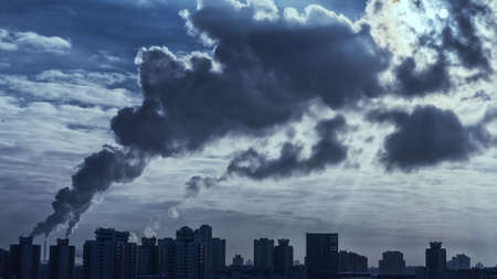 The environment in the city. Smoke from the pipes to overshadow the sun substation.の写真素材