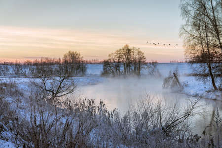 Dawn on a winter river.の写真素材