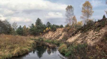 Spring river flowing in a valley. Stitched panorama