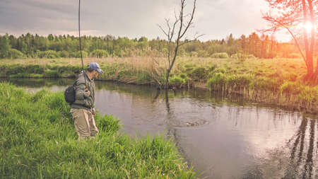 Fishing with tenkara on a small stream. Flyfishing.の写真素材
