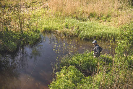 Fishing with tenkara on a small creek. Flyfishing.の写真素材