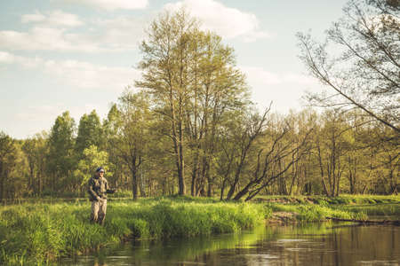 Fishing with tenkara on a small stream. Flyfishing.の写真素材