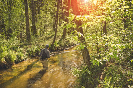 Fishing with tenkara on a small creek. Flyfishing.の写真素材