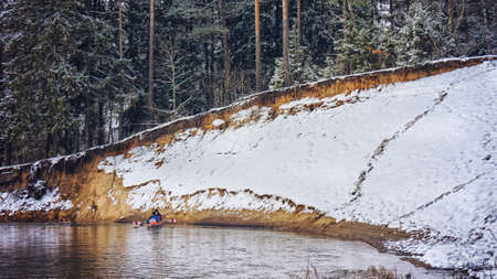 Winter adventure on a kayak.の写真素材