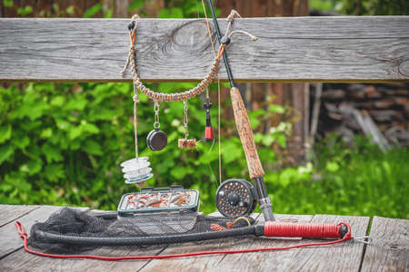 Fishing equipment. Rod, box with flies and landing nets.