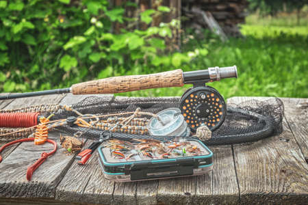 Fishing equipment. Rod, box with flies and landing nets.の写真素材