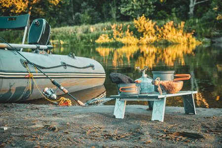 Fishing from an inflatable boat. Lunch on the beach.の写真素材