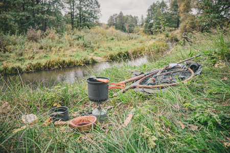 Prepare coffee on the banks of the river on a gas burner.の写真素材