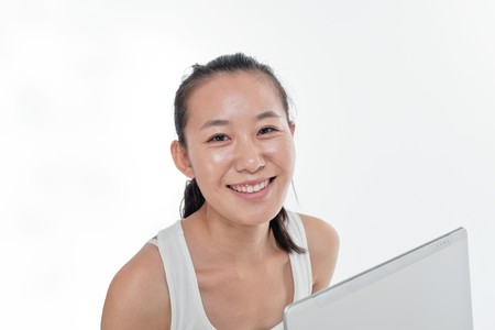 Young woman play her laptop computerの写真素材
