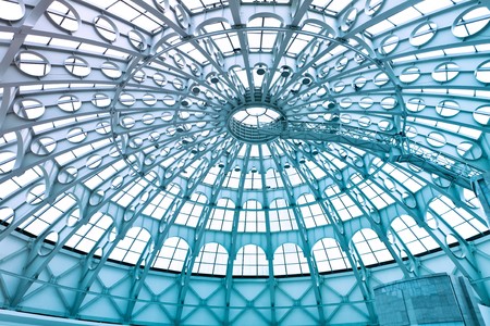 A glass structure supporting the roof of a buildingの写真素材