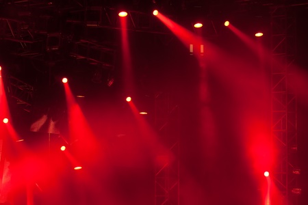 Image of red stage lights, thick fog creates dramaの写真素材