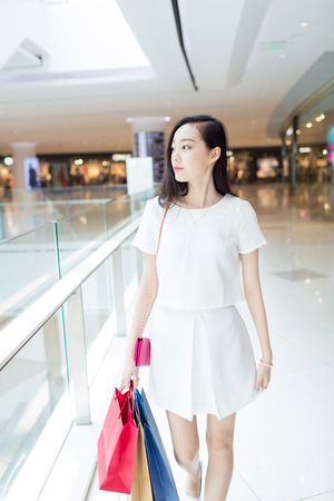 chinese young girl wearing a stylish white dressの写真素材