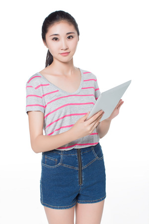 chinese female college student holding a tablet PCの写真素材