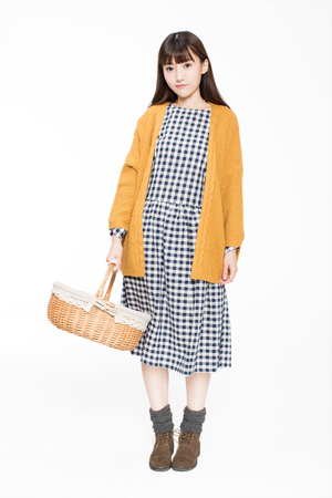 cute chinese girl, carrying a hand-woven bamboo baskets, on white backgroundの写真素材
