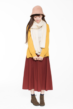 lovely beautiful chinese girl, standing in the studio in white, do the movements showの写真素材
