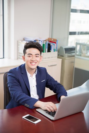 handsome handsome chinese man, owner of a companyの写真素材