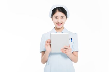 young chinese surgeon using tabletの写真素材
