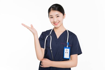 Female surgeon smiling and showing hand gestureの写真素材