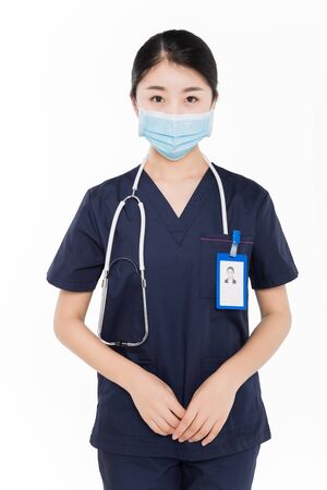 Female surgeon wearing surgical maskの写真素材