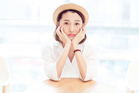 beautiful woman enjoying leisure time in a shopping center,shandong province,china.の写真素材