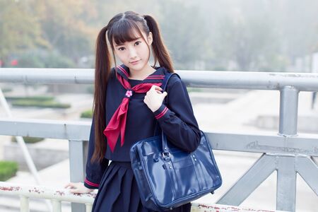 beautiful chinese female students in school uniformsの写真素材