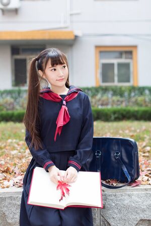 beautiful chinese female students in school uniformsの写真素材