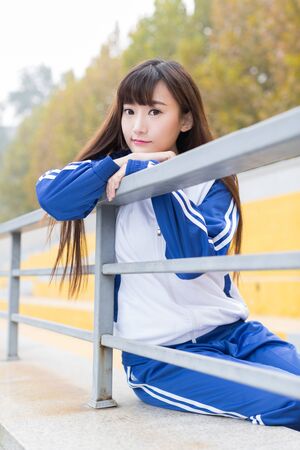pretty girl with long hair wearing blue uniformsの写真素材