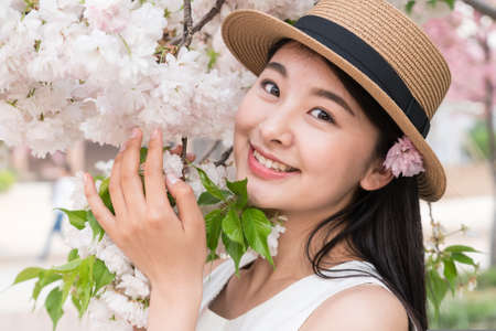 asina woman enjoying the lake view, in spring