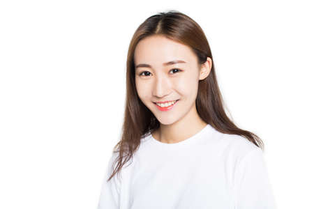 beautiful girl sitting on the ground over white background.の写真素材