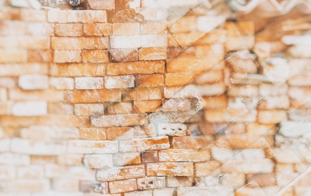 Double exposure of the stonewall from old bricks. It is retro style background or texture.
