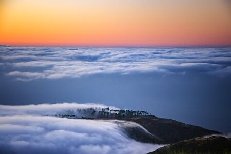 Nature background with sunrise over clouds. It is on the top of Pico do Arieiro mountain, Madeira...