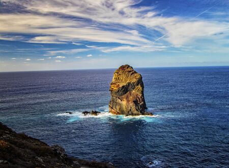 Rocky cliffs on the shore of the island of Madeira, Portugal. This amazing place is Ponta de Sao Lourenco. The most beautiful trail on Madeira Island. It is nature background. It is summer.の写真素材
