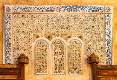 Detail of Islamic Mosque. It is an old architectural building in the middle of the Moroccan city. There are red bricks. It's a beautiful pattern.の写真素材