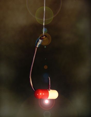 addictive pill on a hookの写真素材
