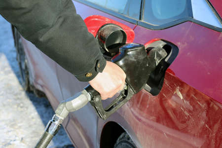 Man filling his car up with gasolineの写真素材